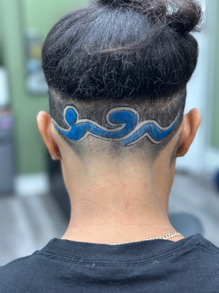 Blue wave color design cut into an undercut below a top bun
