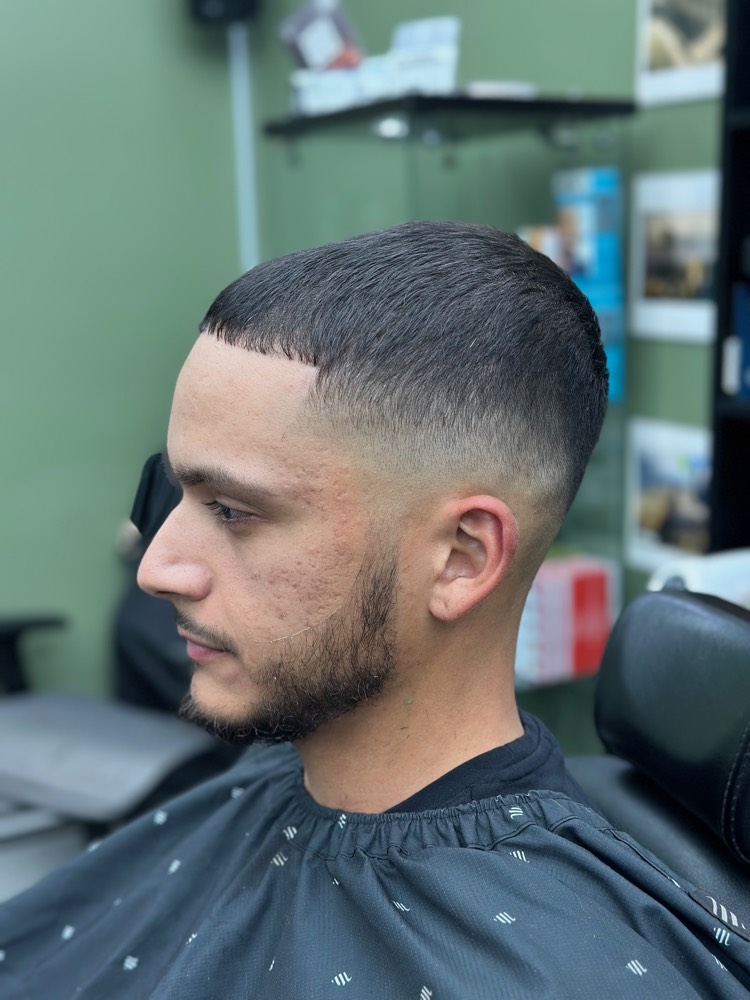 Textured crop comb-over with high skin fade and tight lineup
