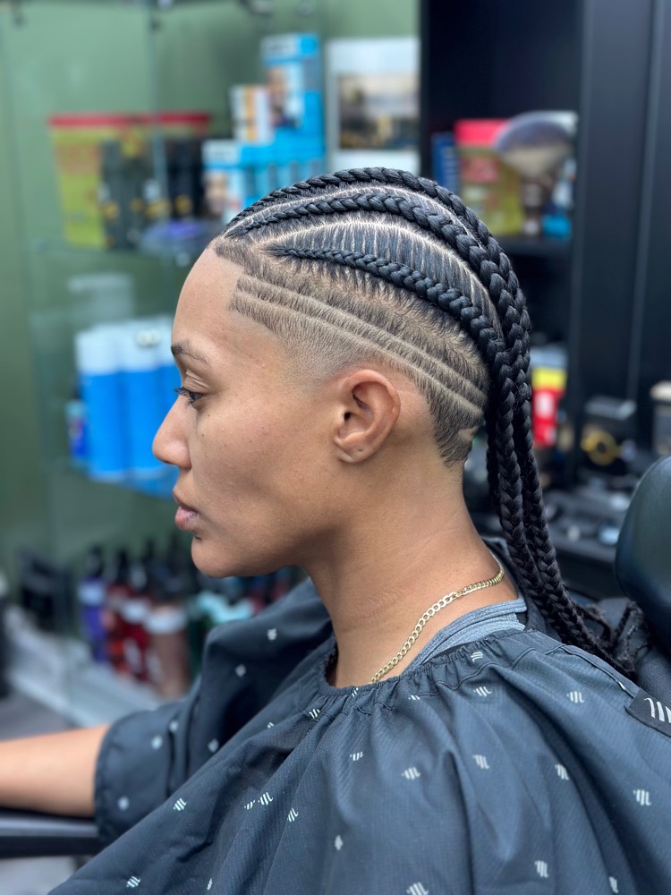 Feed-in cornrows into a long braided ponytail with geometric shaved design