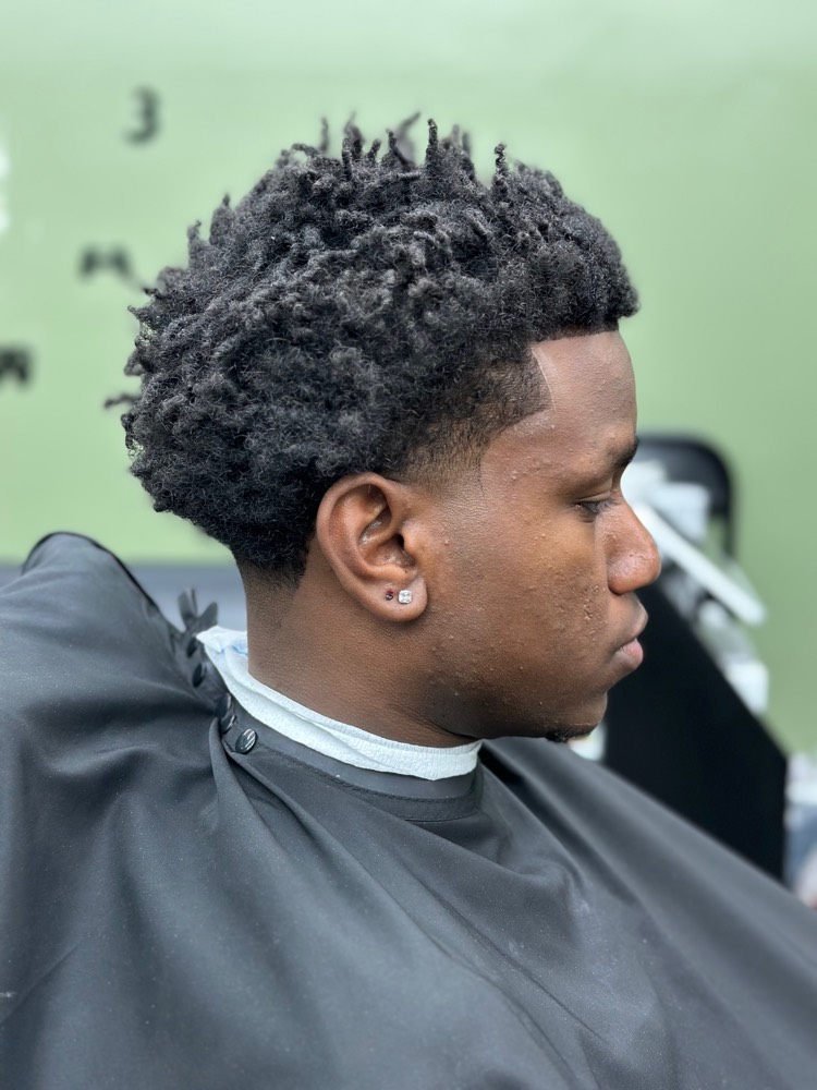 Sponge twist afro with taper fade and clean lineup