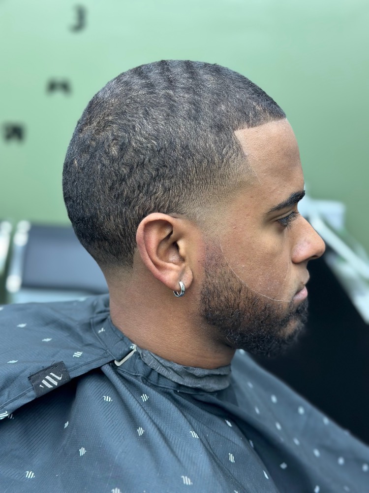 360 waves with low taper fade blended into the beard